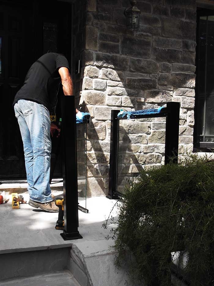 Aluminum-Glass-Railing-During-InstallationProcess-infront-of-the-house-in-New-Market-Ontario by aluminumwindowstoronto.ca